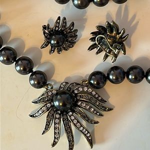 Heidi Daus black beaded necklace with earrings and a ring.